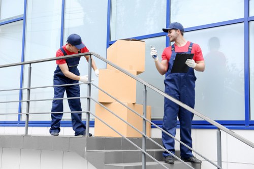 Professional movers handling boxes in Edgware