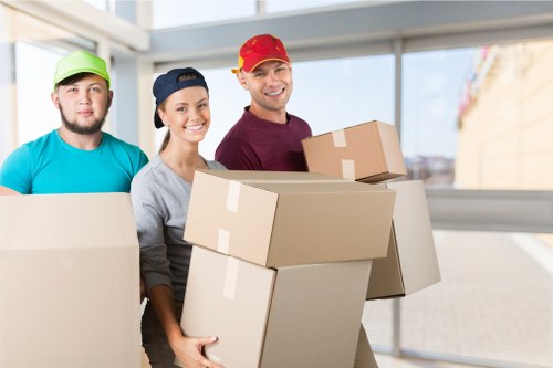 Charity donation boxes and reusable household items from an Edgware move