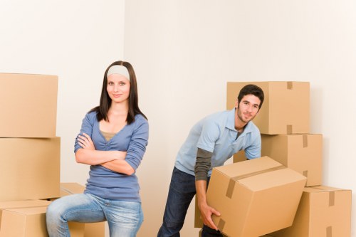 Packed office boxes and furniture ready for local relocation