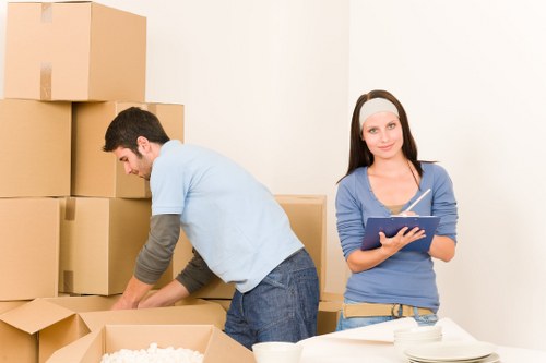Staff completing a risk check before a house removal